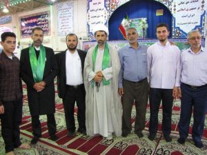 گزارش تصویری/خادمان حامل پرچم حرم مطهر امام رضا(ع) در نماز جمعه کارون