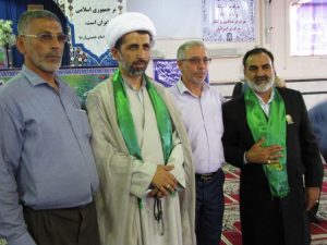 گزارش تصویری/خادمان حامل پرچم حرم مطهر امام رضا(ع) در نماز جمعه کارون